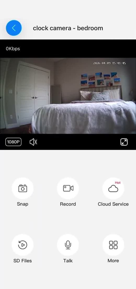 The tCam app live view showing a real bedroom camera feed